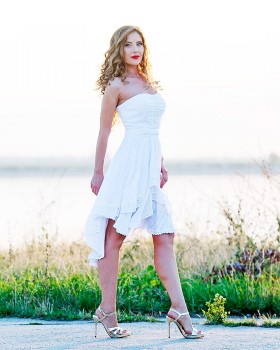 Romantic white strapless dress with pleated bodice and lace inserts
